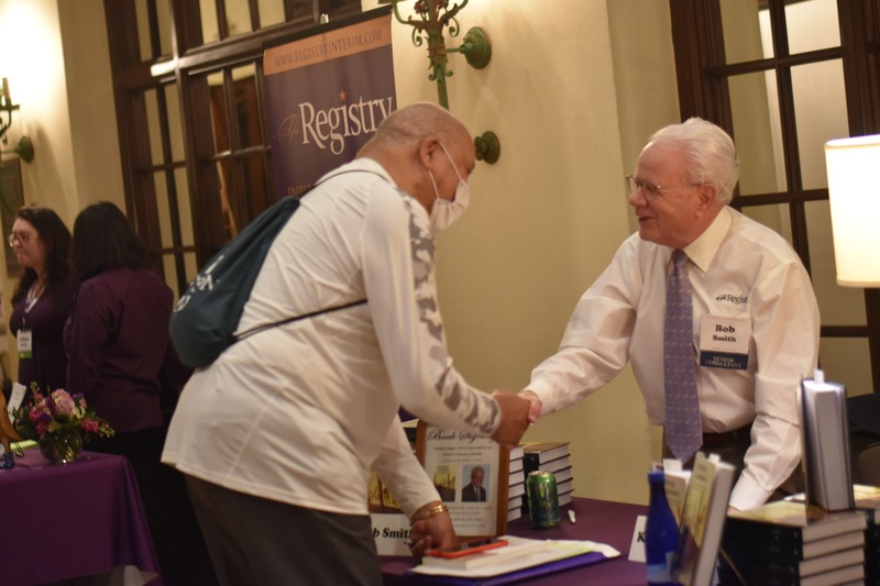 Registry Senior Consultant Bob Smith discussed his book with Registry Members throughout his signing, offering further insight into his pages.